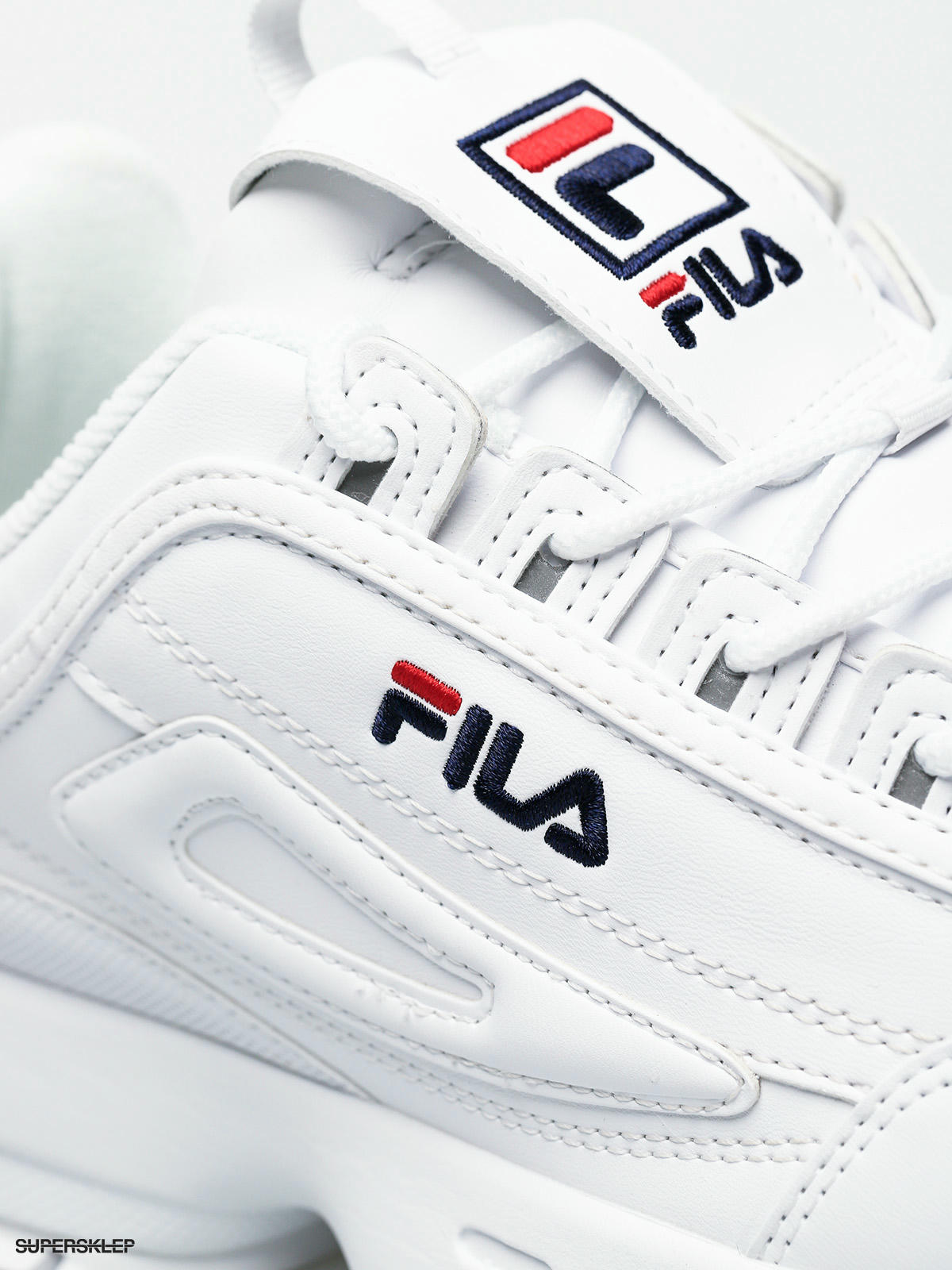 fila disruptor glossy white