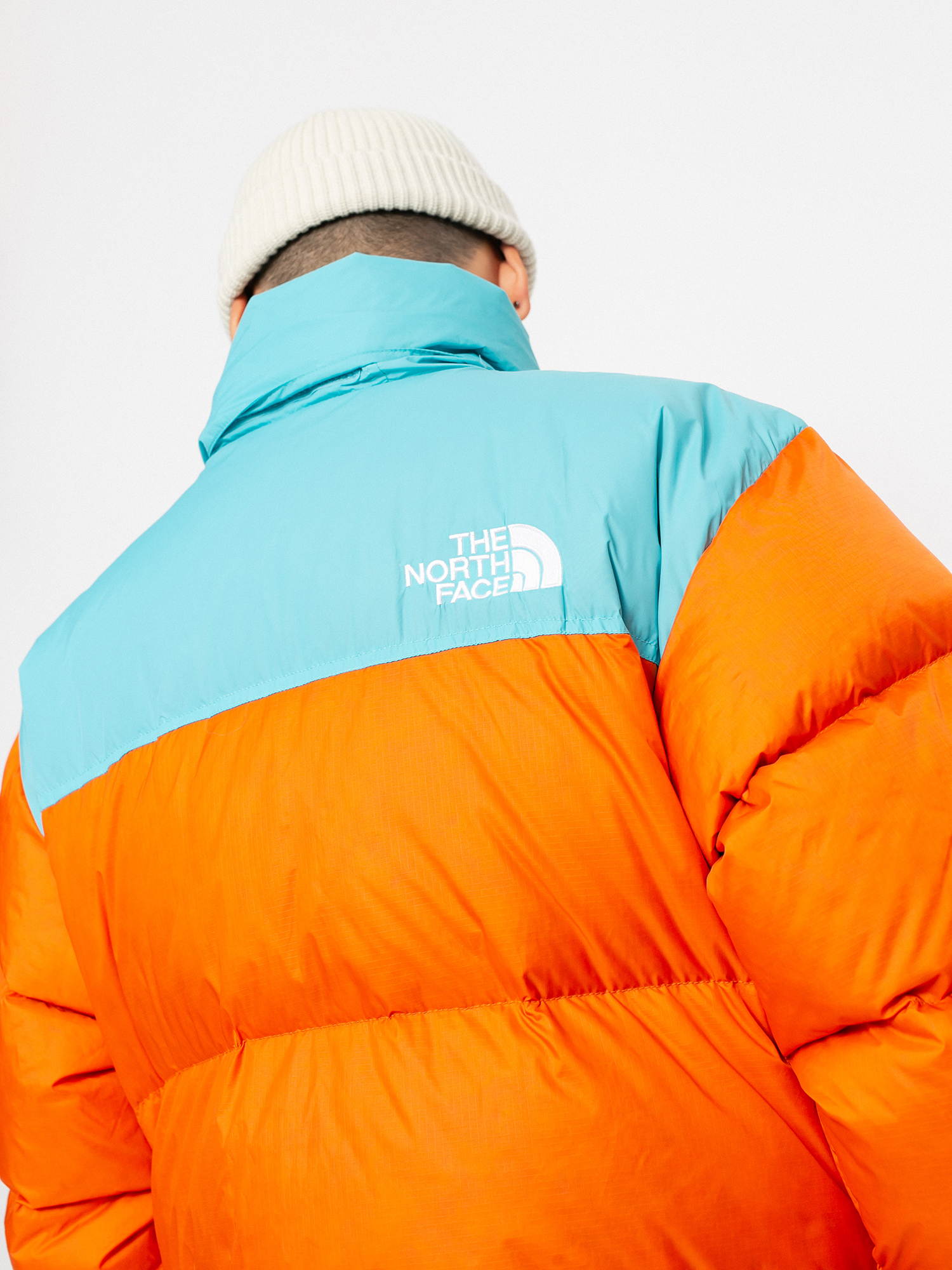 Bunda The North Face 1996 Retro Nuptse (red orange/transantarctic blue)
