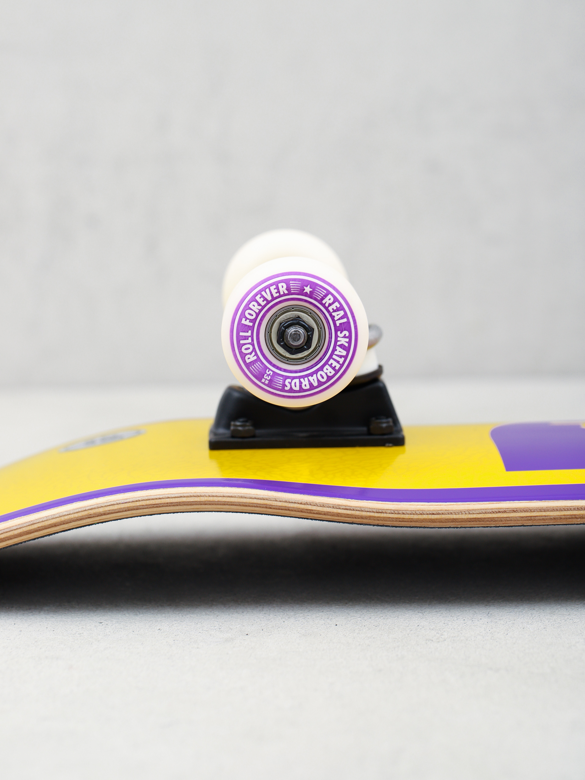 Skateboard Real Doves II (yellow/purple)