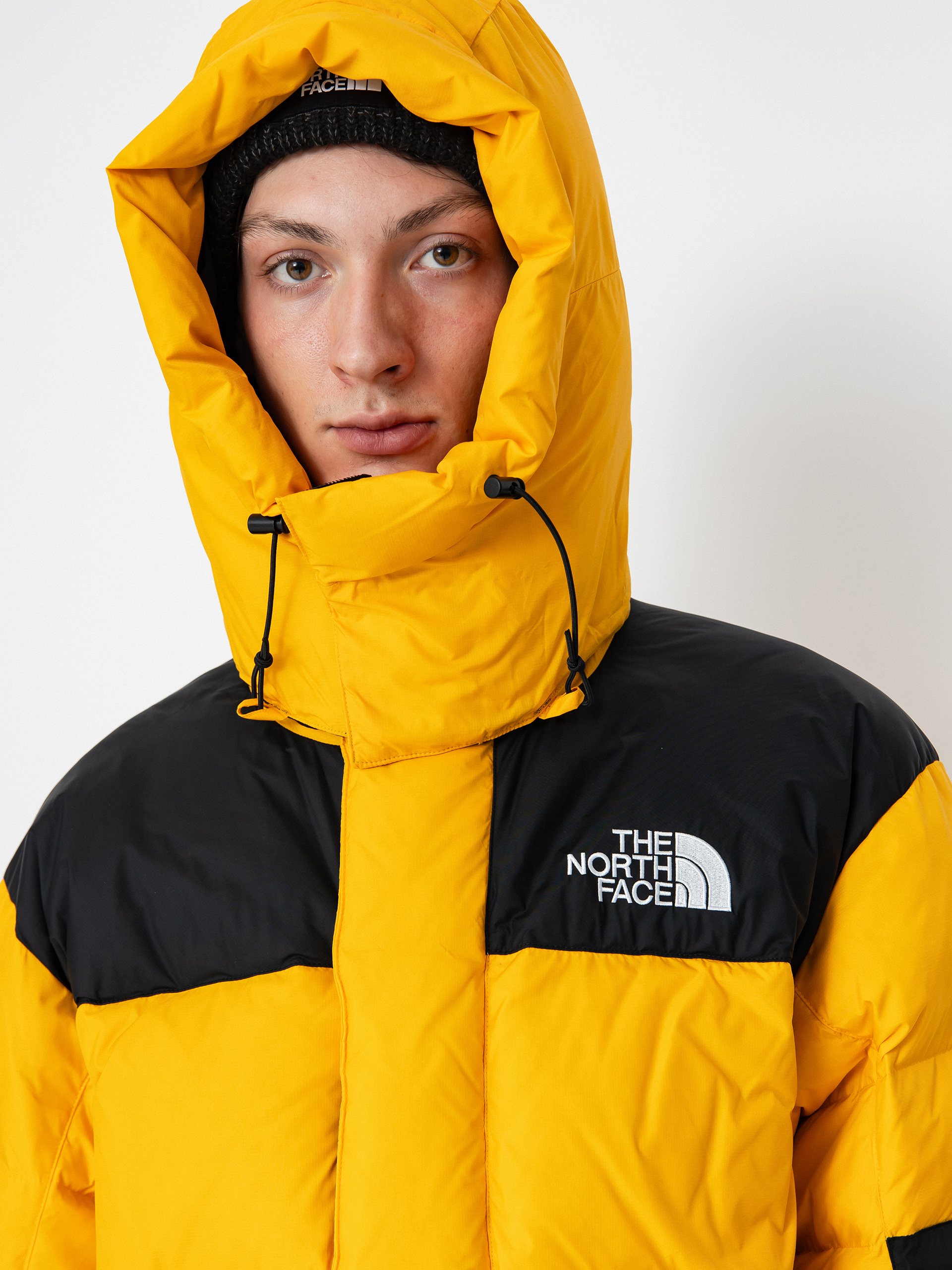Bunda The North Face Hmlyn Baltoro (summit gold tnf black n)