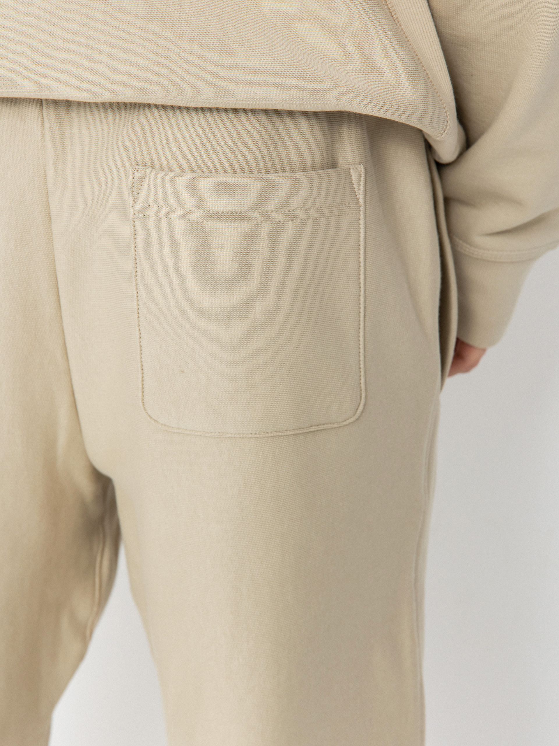 Kalhoty Carhartt WIP American Script Jogging (fleur de sel)