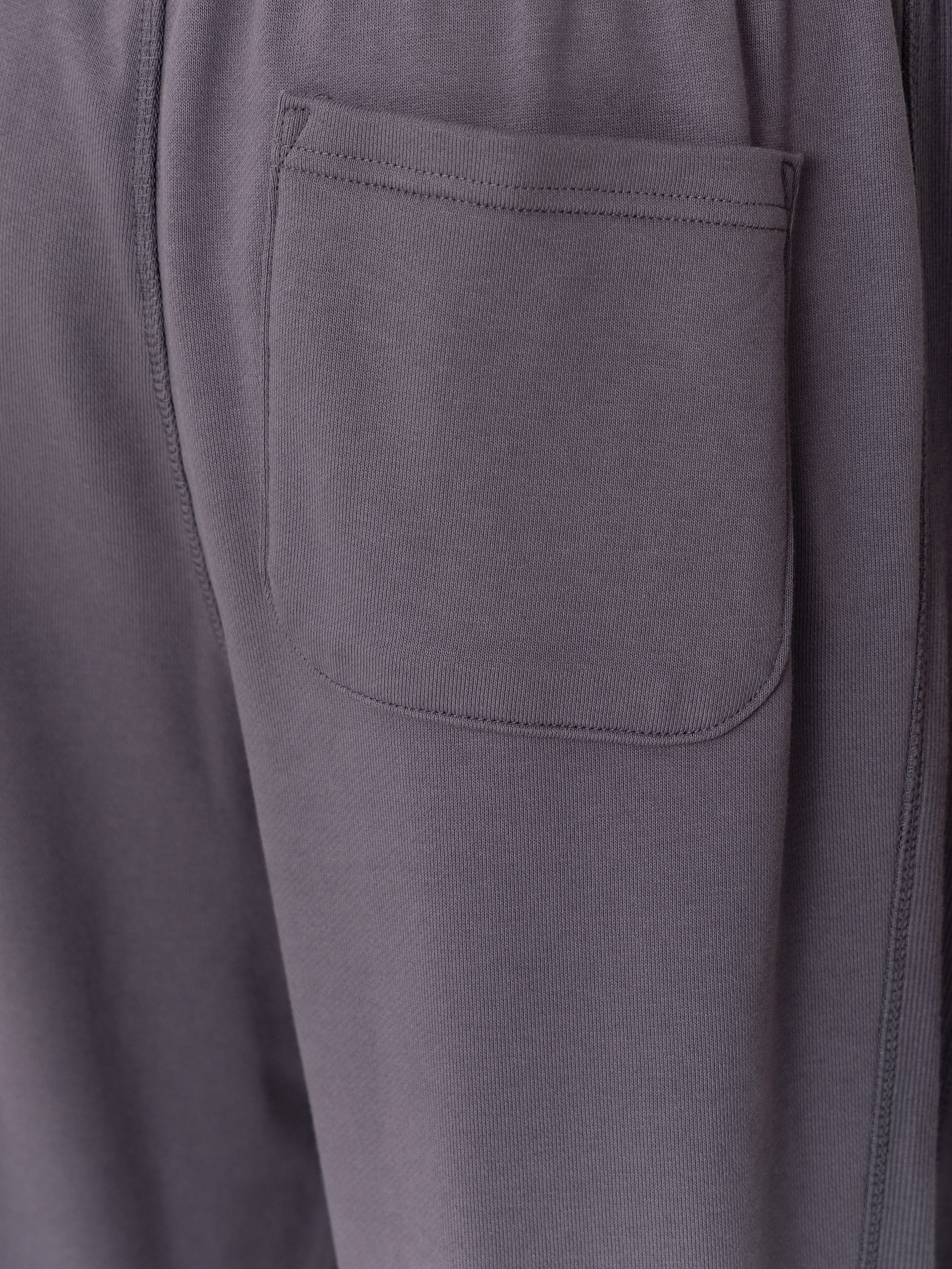 Kalhoty New Balance Athletics French Terry Jogger (neptune grey)