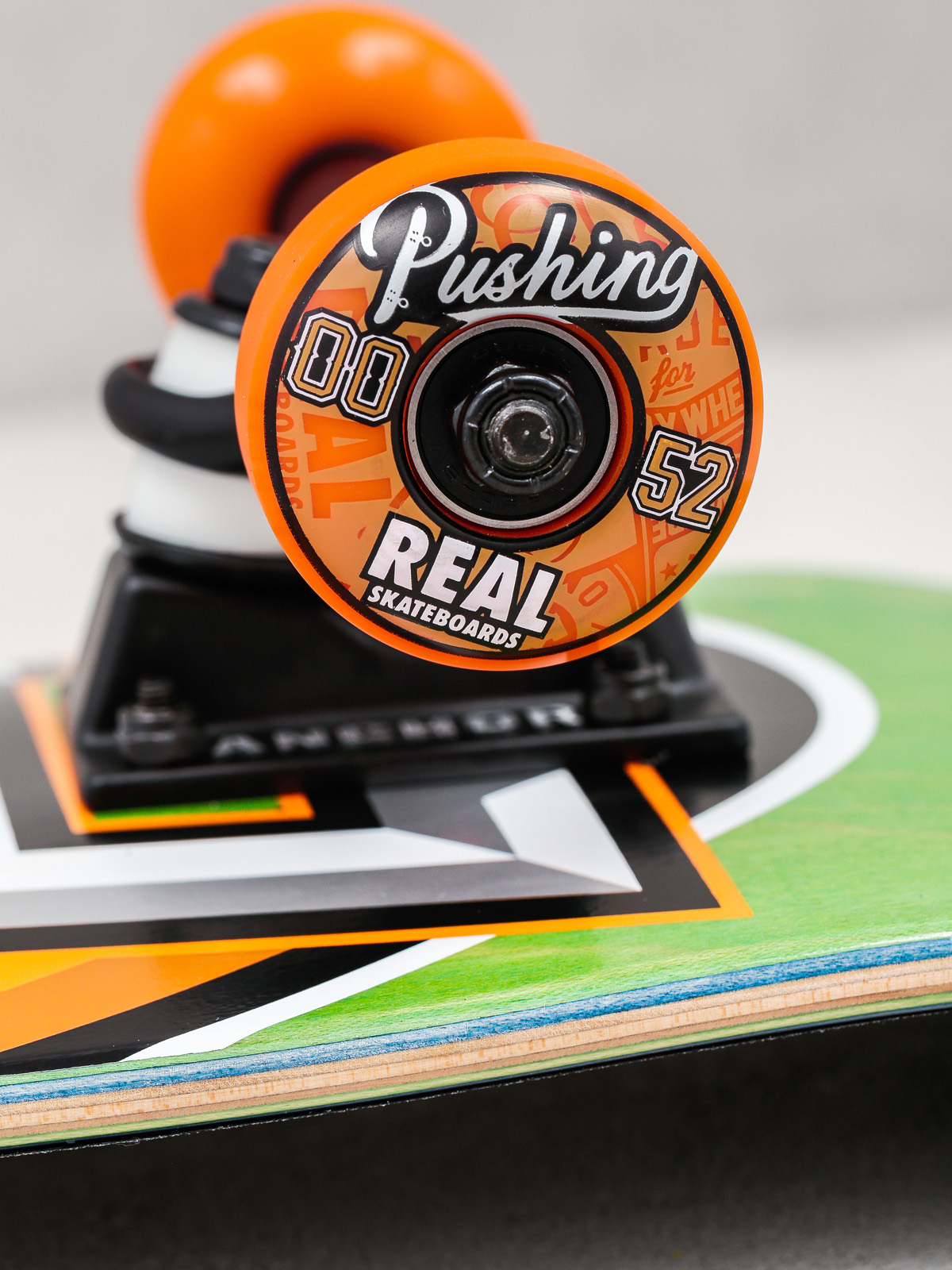 Skateboard Real Alumni Small (green/orange)